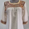 blusa  deshilada a mano  de moños