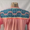 vestido punto de cruz tela rosa con olan y bolsas