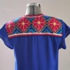 Vestido azul rey punto de cruz con bordado fuccia
