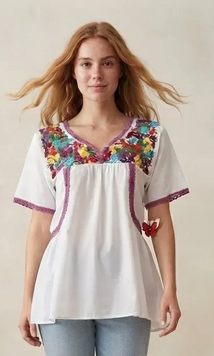 Blusa artesanal bordada con margaritas multicolor