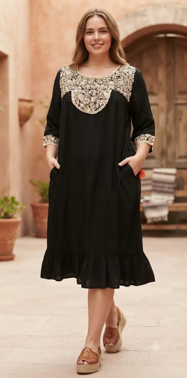 Vestido negro con bordado artesanal en hilo de seda beige