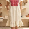 Vestido hueso punto de cruz rojo con morado