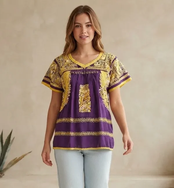 WhatsApp Image 2026-10-12 at 4.22.09 PM Blusa morada bordado amarillo matizado
