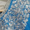 Blusa sencilla turquesa con plata