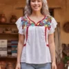WhatsApp Image 2026-10-12 at 6.48.06 PM Blusa blanca sencilla con randa en costado