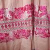 Vestido palo de rosa con deshilado moños y bordado en tonos rosa