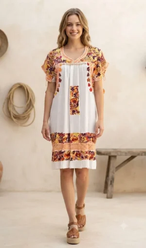 Vestido tela hueso bordado pensamientos tonos rojos y mostazas tejido melón