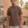 WhatsApp Image 2026-10-14 at 5.29.35 PM Guayabera café cuello mao con una randa de samilla