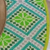 WhatsApp Image 2026-10-15 at 9.21.26 PM Sombrero lana de borrego verde tierno bordado punto de cruz tonos verde