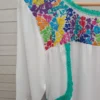 WhatsApp Image 2026-10-22 at 12.45.51 PM Blusa tela blanca cajón bordado multicolor y tejido jade