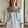 WhatsApp Image 2026-10-22 at 12.46.30 PM Blusa tela blanca cajón bordado multicolor y tejido jade