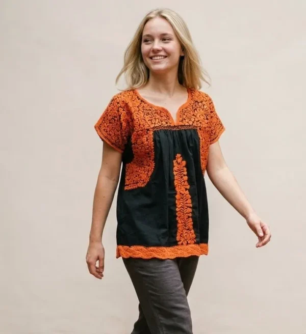 Blusa tela negra con naranja