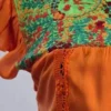 Blusa tela naranja con bordado solo en cajón tejido naranja