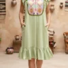 Vestido punto de cruz tela verde con colores